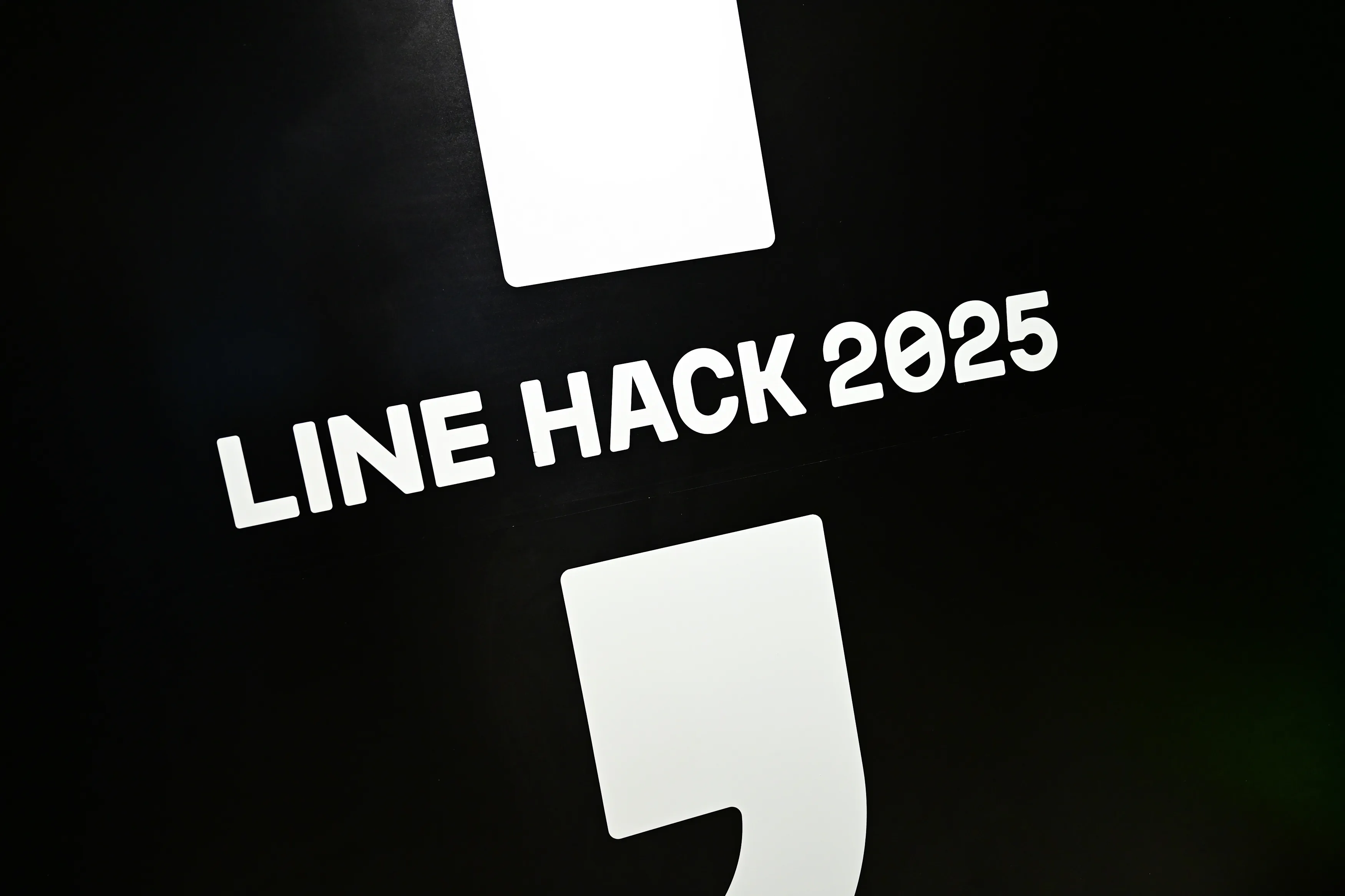 LINE HACK 2025 event identity applied inside the Bangkok hackathon venue.