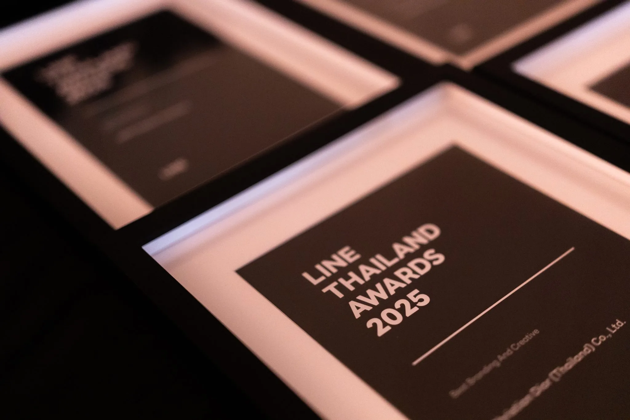 Close view of printed LINE Thailand Awards materials.