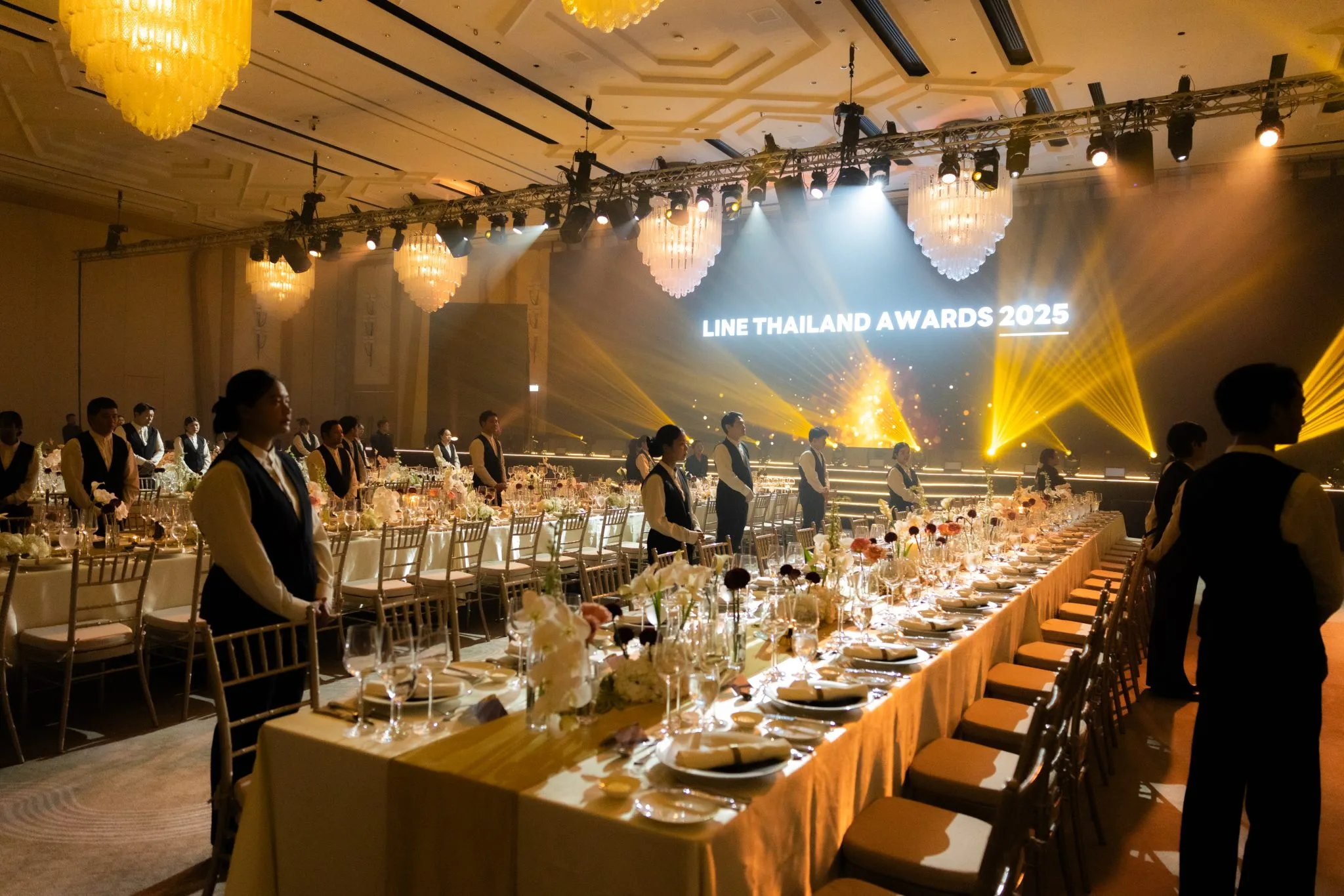 Dining area facing the illuminated awards stage.